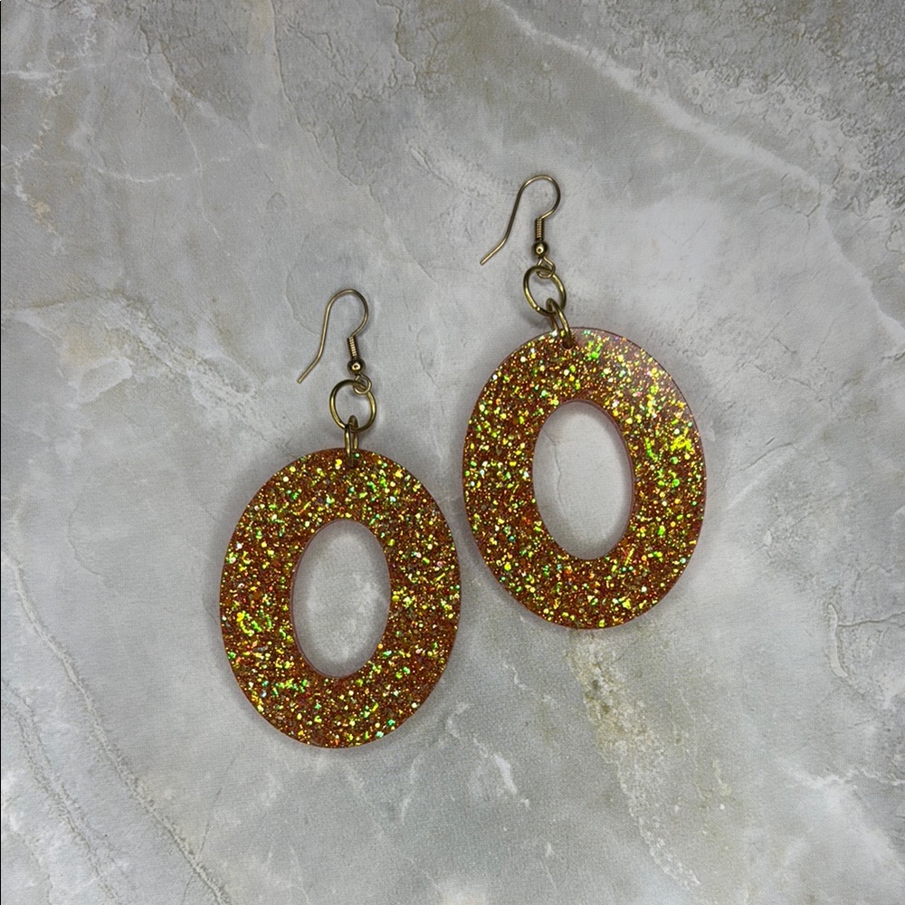 Glittering Orange Oval Earrings
